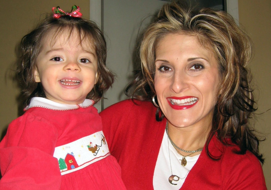 Elena Patrice and her young daughter smiling together.